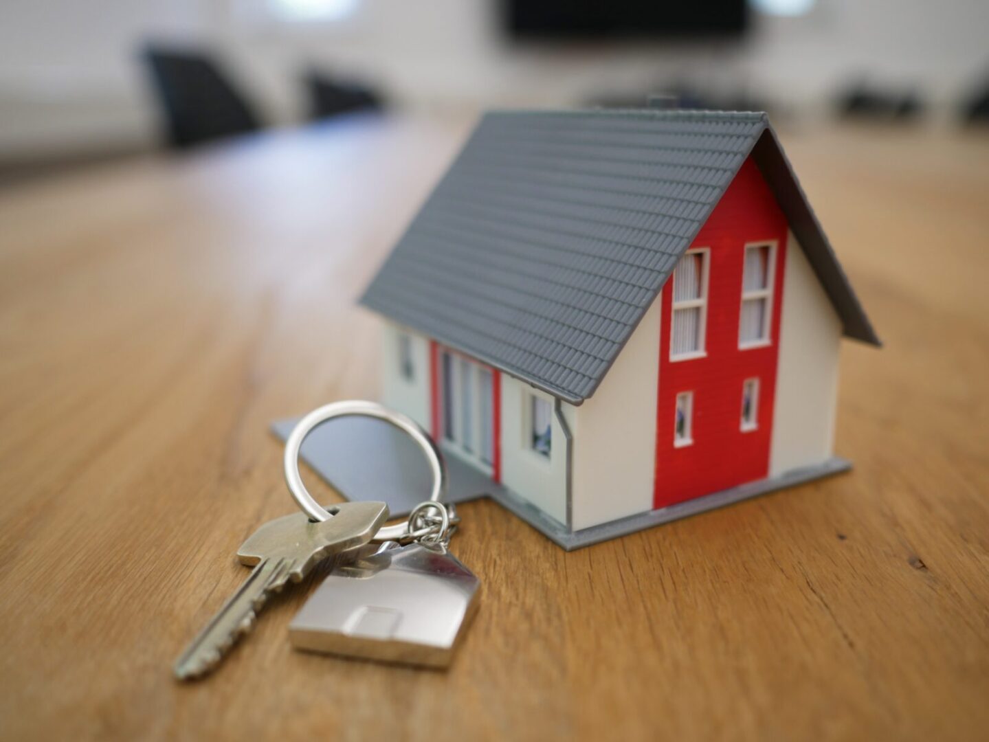 A key is sitting on top of a table.