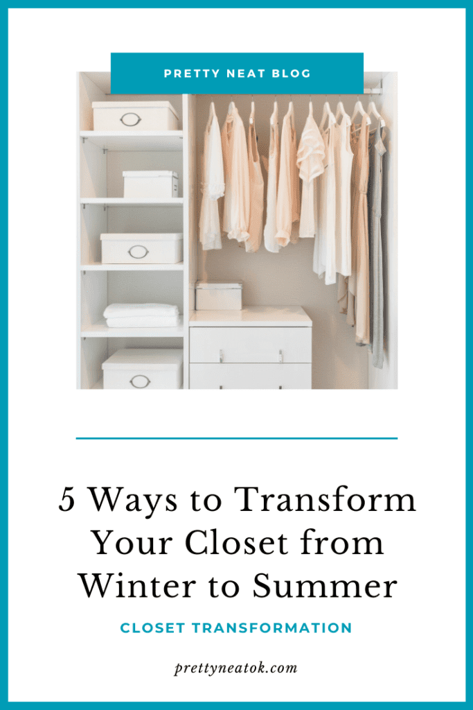 A white closet with clothes hanging on it.