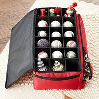 A red bag filled with christmas ornaments.