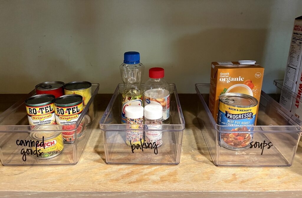 A kitchen counter with three containers of food.