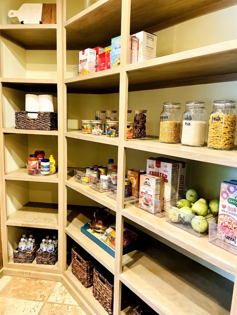 A large pantry with many shelves of food.