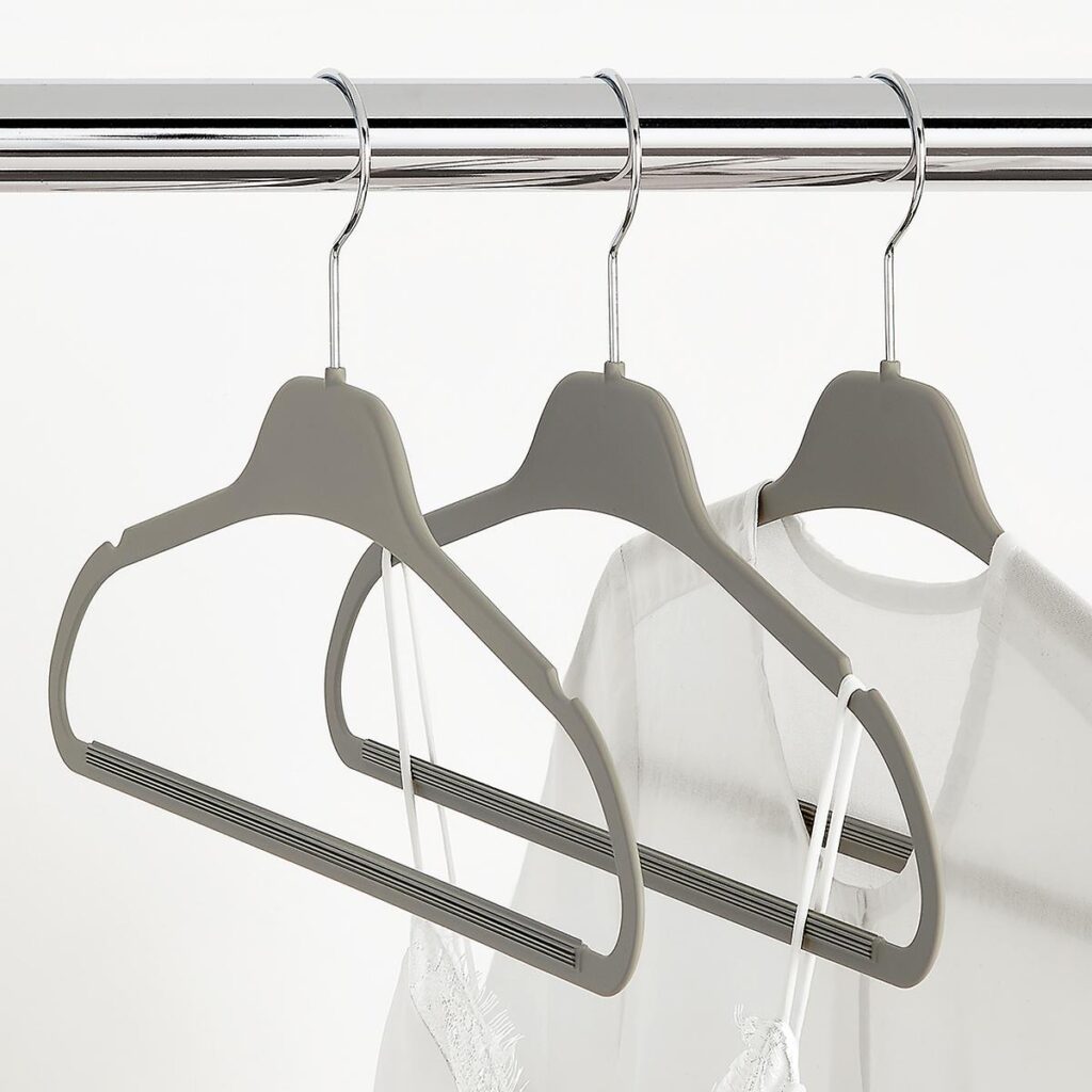 Three hangers are hanging on a rack.