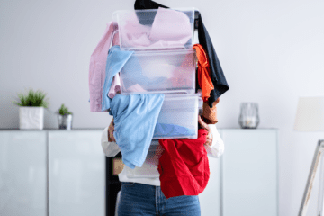 pretty-neat-oklahoma-city-declutter-your-home-woman-holding-boxes-of-clothes