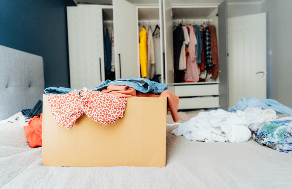 pretty-neat-an-organizational-solution-nichols-hills-routine-suggestions-a-box-of-clothes-to-donate-on-the-bed