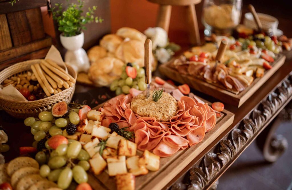 professional-home-organizing-norman-ok-organizing-tips-for-thanksgiving-snack-table-set-with-platters-and-bowls-of-snacks-meats-fruits-crackers-decluttering