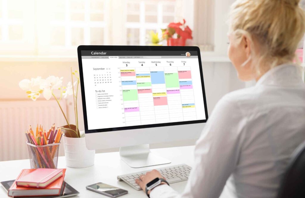 pretty-neat-moore-ok-non-physical-ways-to-organize-woman-viewing-calendar-on-computer-screen-reduce-stress-office-organization