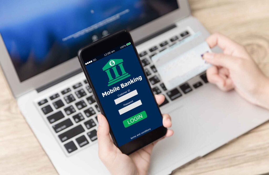 professional-home-organizing-norman-ok-non-physical-ways-to-organize-woman-at-computer-with-phone-logging-in-to-mobile-banking-calm