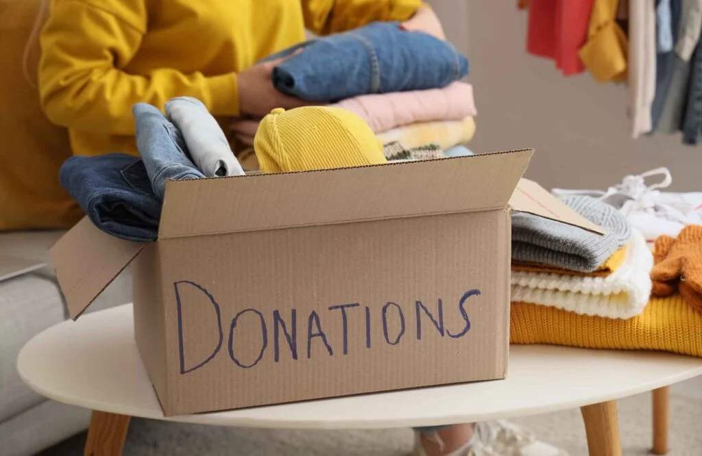 move-management-specialists-nichols-hills-ok-closet-organization-tips-donation-box-with-clothing-to-give-away-confidential