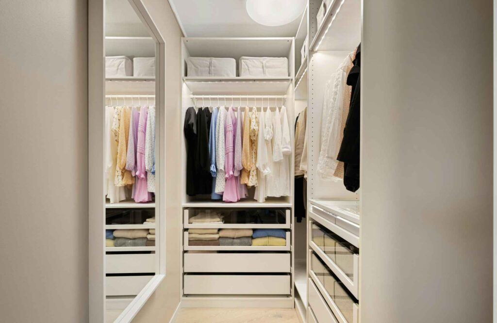 pretty-neat-oklahoma-city-ok-signs-you're-ready-to-hire-a-professional-organizer-neat-tidy-narrow-closet-large-mirror-shelves-and-bins-decluttering