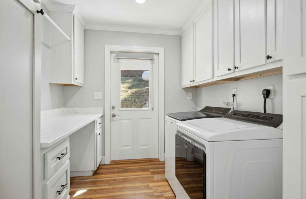 professional-home-organizing-moore-ok-laundry-room-organization-tips-laundry-room-with-cabinets-drying-rack-folding-station-calm-closet-organization