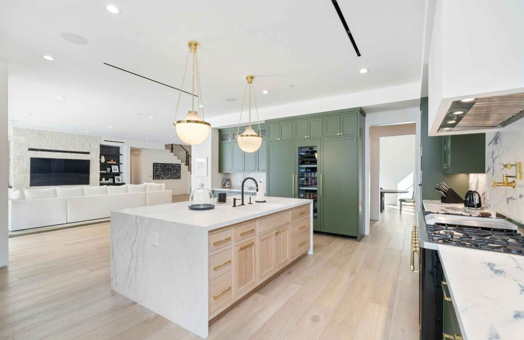 move-management-specialists-norman-ok-home-organization-process-kitchen-living-room-open-floor-plan-waterfall-island-light-wood-floors-calm