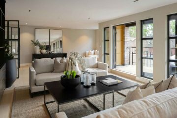 pretty-neat-nichols-hills-ok-home-organization-process-minimalist-high-contrast-black-and-white-living-room-sliding-doors-to-outside-comfortable-furnishings