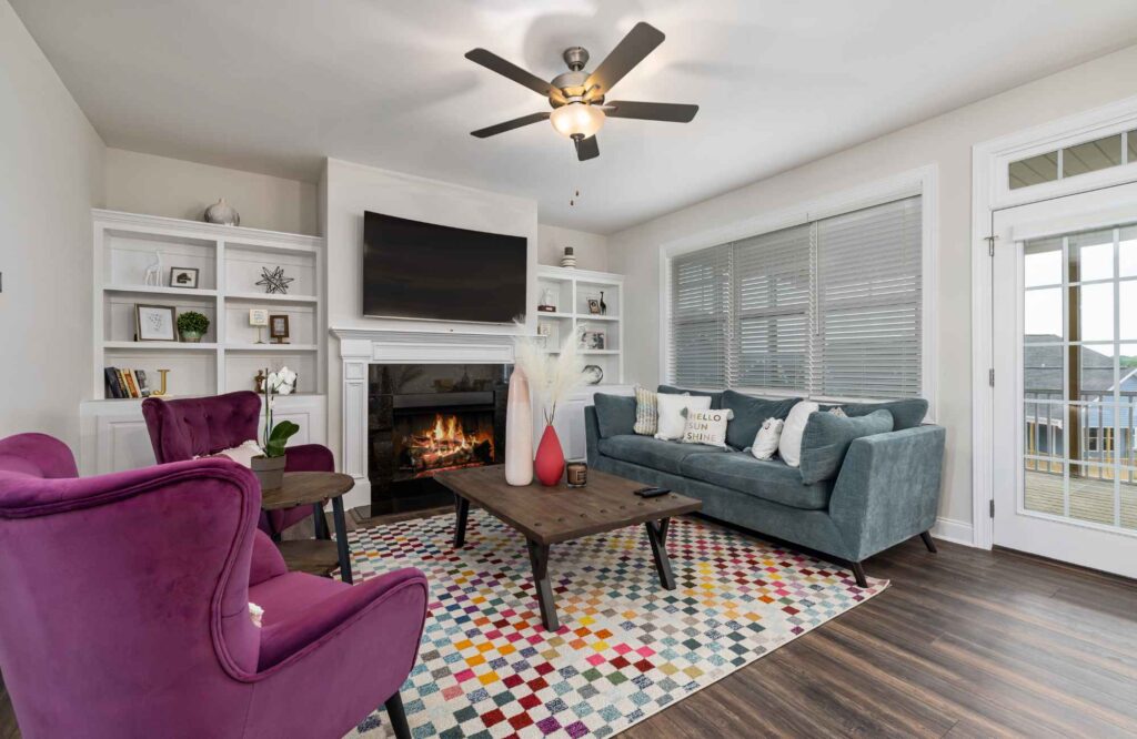 pretty-neat-oklahoma-city-ok-home-organization-process-living-room-with-pink-upholstered-chair-gray-sofa-colorful-decluttering-move-management