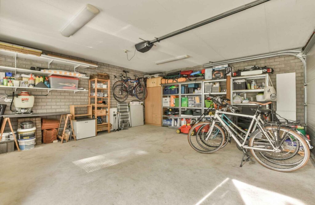 pretty-neat-edmond-ok-summer-decluttering-organized-garage-bikes-shelves-with-bins-neat-and-tidy-comfortable-office-organization