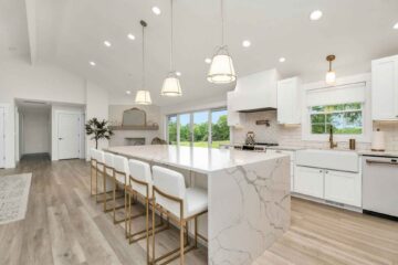 pretty-neat-edmond-ok-story-behind-clutter-luxury-kitchen-waterfall-island-white-cabinets-decluttering-move-management-specialists